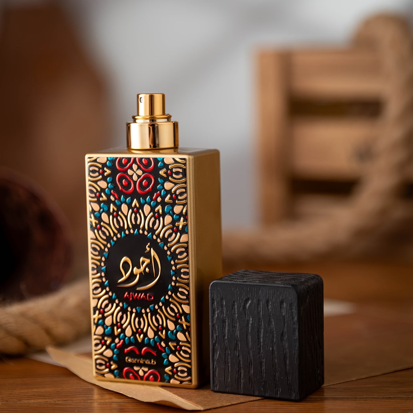 Decorative perfume bottle with intricate design on a wooden surface