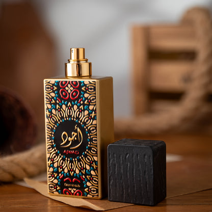Decorative perfume bottle with intricate design on a wooden surface