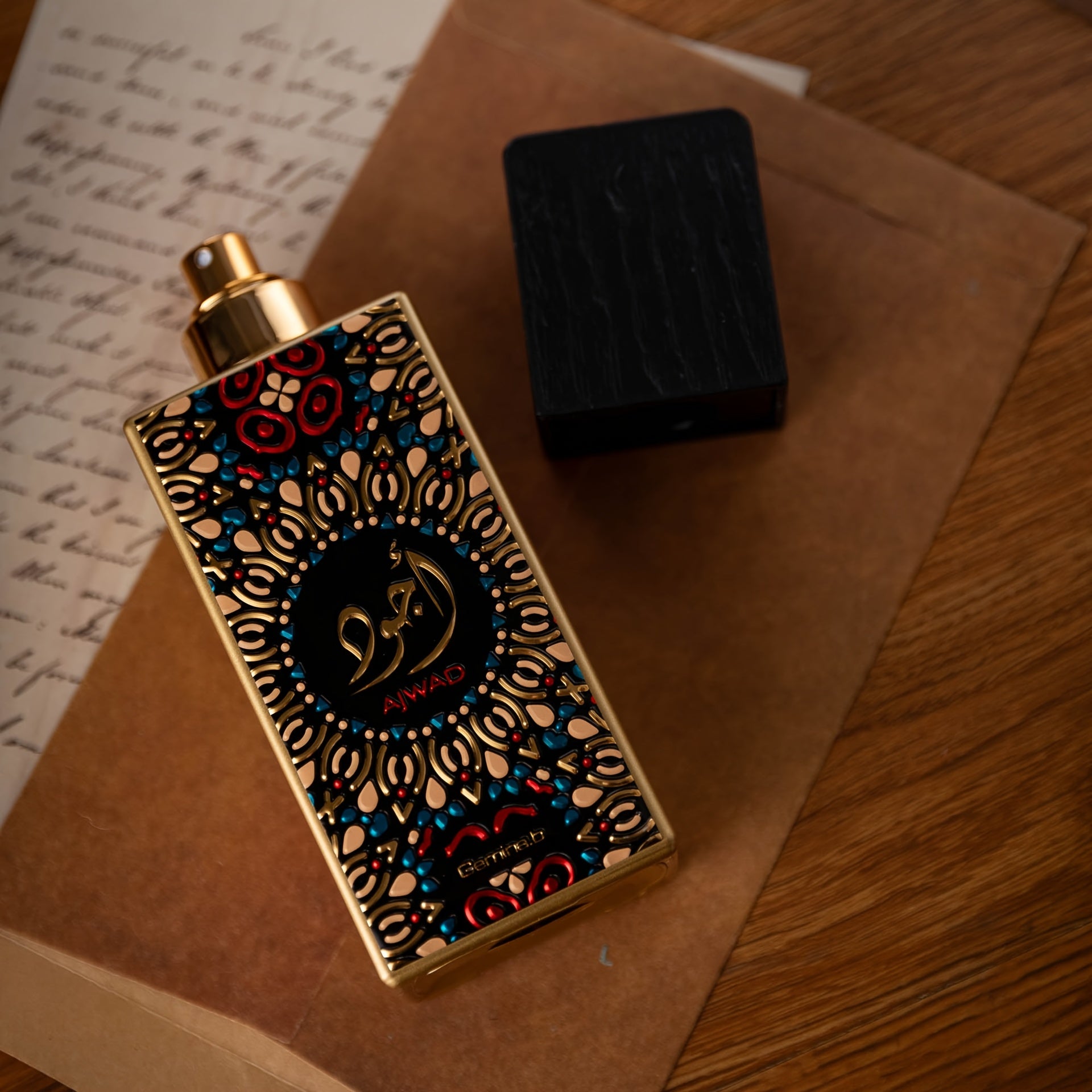 Decorative perfume bottle with intricate design on a wooden surface