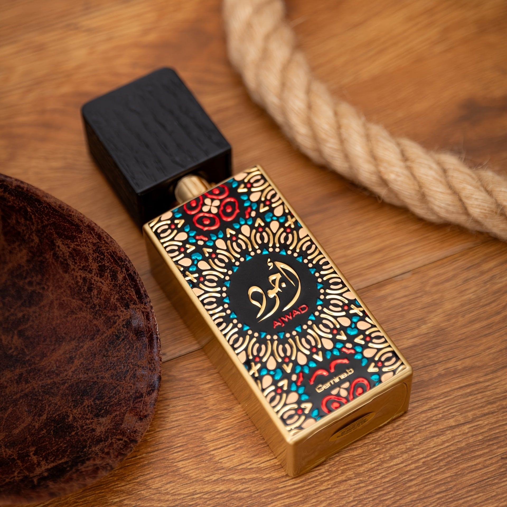 Decorative perfume bottle with intricate design on a wooden surface