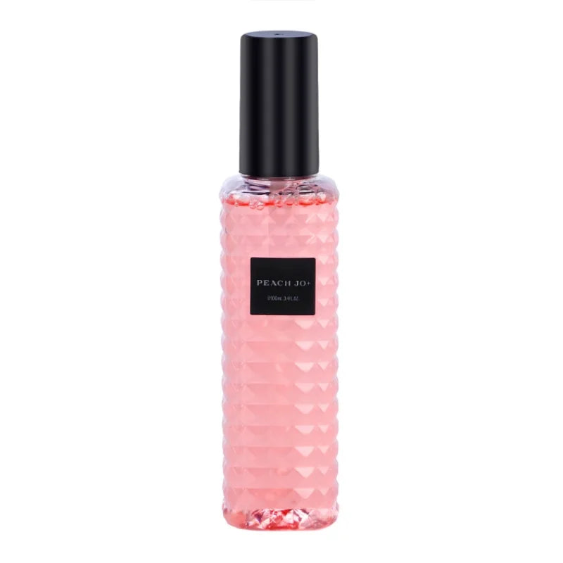 Pink bottle with black cap on a white background